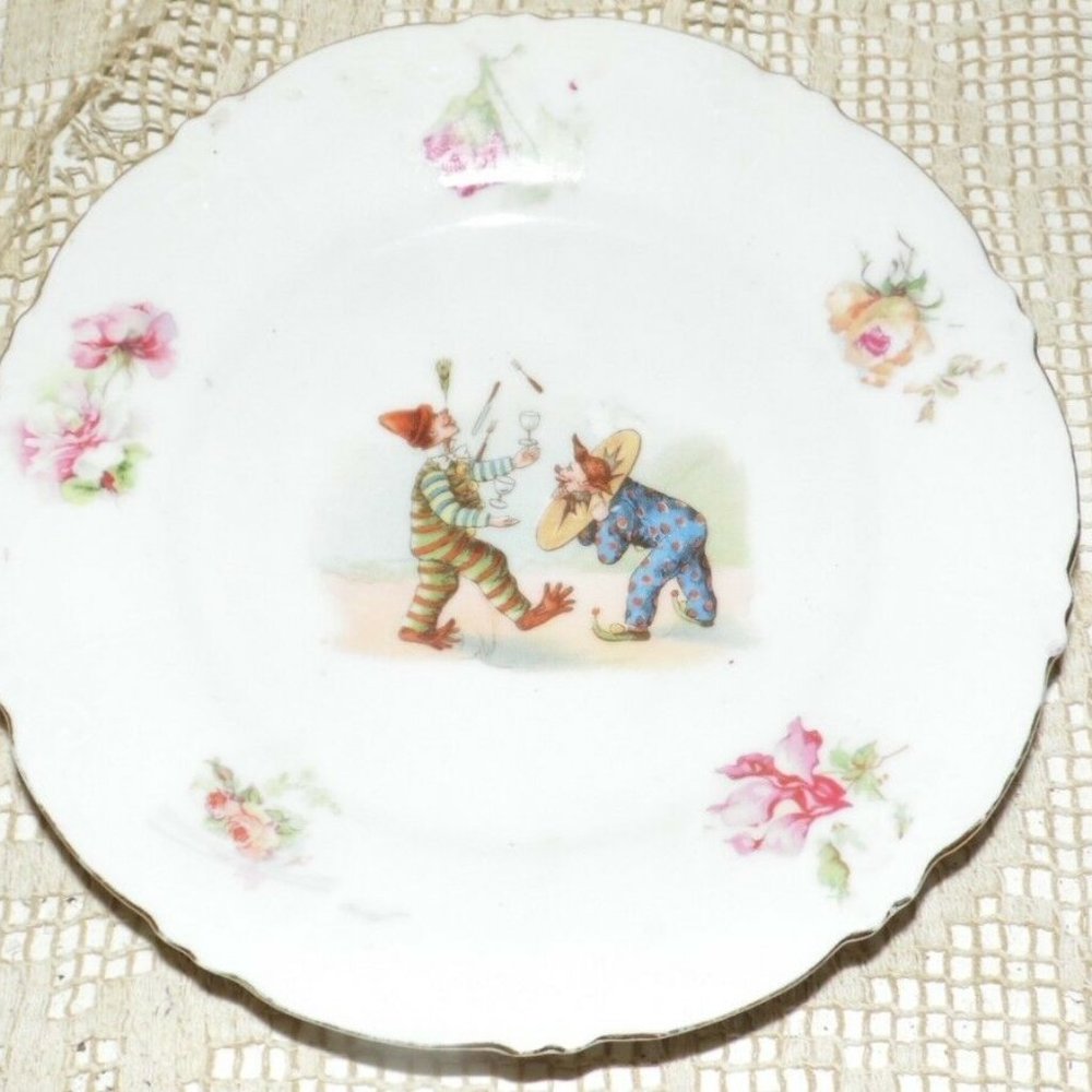 ANTIQUE PORCELAIN GERMANY CLOWNS DOING JUGGLING TRICKS LITHO FLORAL DESIGN PLATE